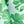 Close-up of leaf-printed tablecloth fabric with pale blue and green pattern