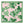 Square pale pink napkin with bold green fig leaf pattern and green edge border