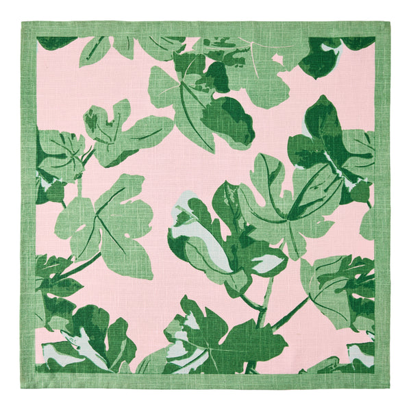 Square pale pink napkin with bold green fig leaf pattern and green edge border