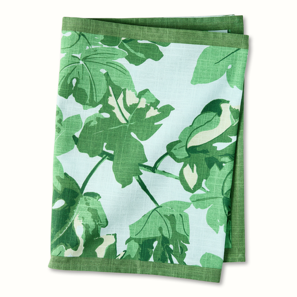 Pale blue runner with green fig leaf pattern, folded