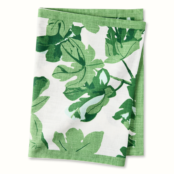 Fig leaf printed table runner, white ground with green leaf pattern, folded view.