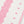 White runner with pink repeating motif print and stripe trim