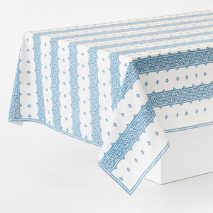 Blue and white printed tablecloth with border stripes and geometric motifs