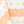 White tablecloth with orange geometric motifs and patterned border