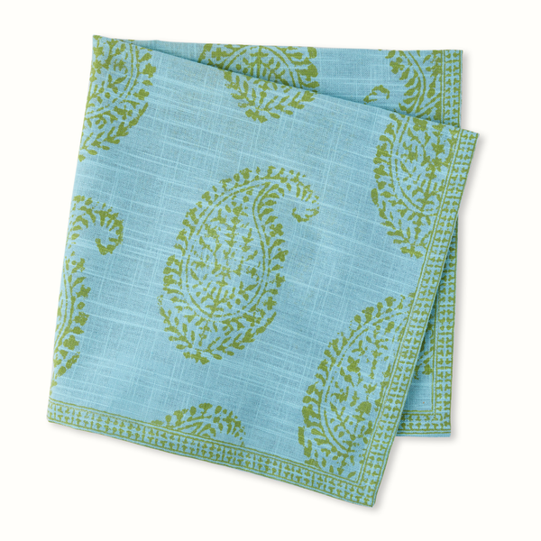 Blue napkin set with green paisley print and stitched border, folded