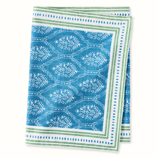 Blue jaali printed runner with white motif and green border, folded display