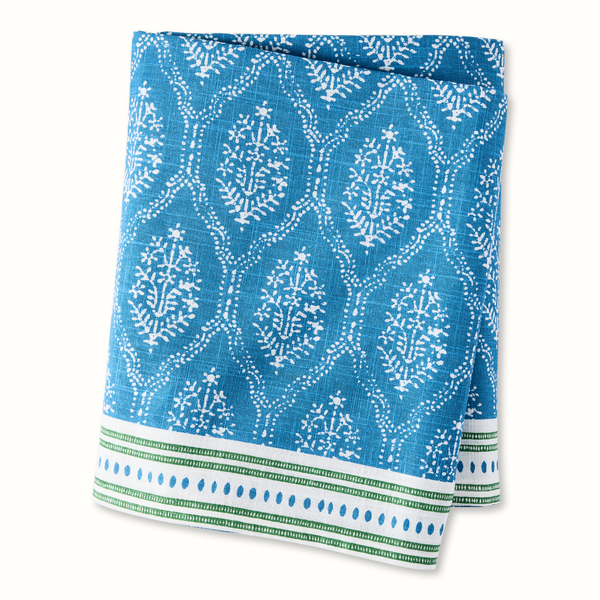 Blue jaali printed tablecloth with white floral lattice, green striped and dotted border
