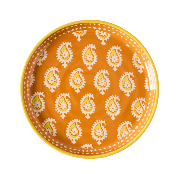 Orange melamine salad plate with yellow rim and white teardrop pattern
