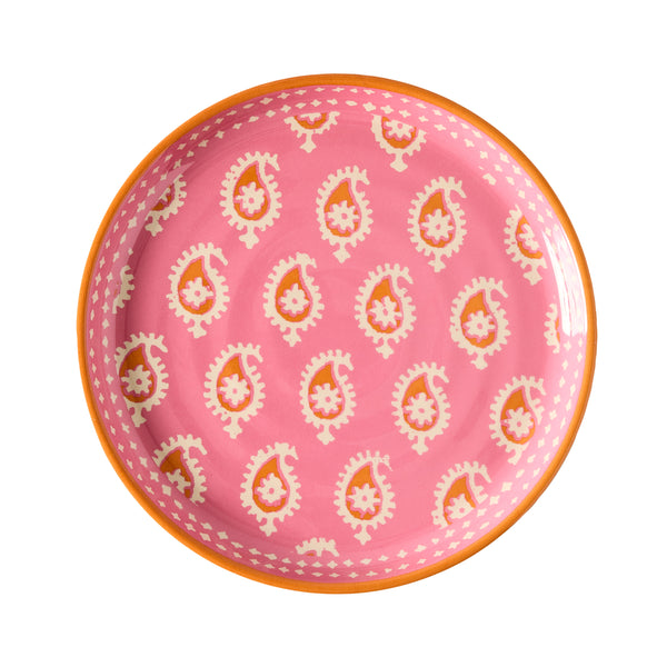 Pink melamine salad plate with orange rim and repeating paisley pattern