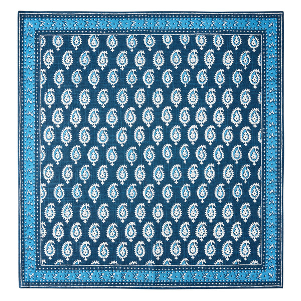 Blue printed napkin with repeating paisley medallions and border frame