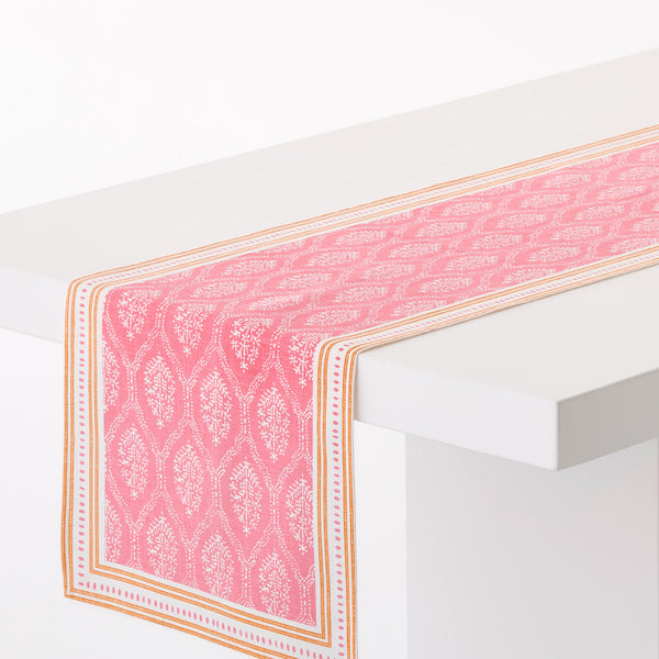 Pink printed runner rug with orange border and corner jaali pattern