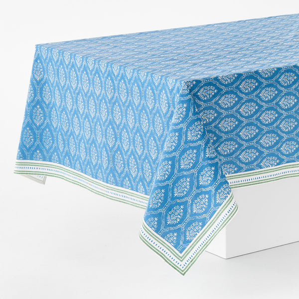 Blue jaali printed tablecloth with white geometric motifs and green-striped border