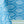 Blue tablecloth with white jaali geometric pattern, close-up fabric texture