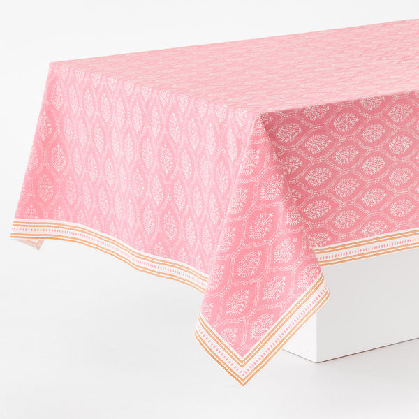Pink jaali printed tablecloth with orange and white border, rectangular drape