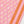 Pink printed runner with repeating medallions and orange striped panel close-up