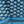 Blue printed tablecloth fabric close-up with circular motifs and striped border