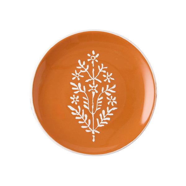 Orange appetizer plate with white floral tree motif and cream scalloped edge
