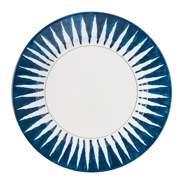 Indigo blue sunburst dinner plate with radial striped pattern and off-white center