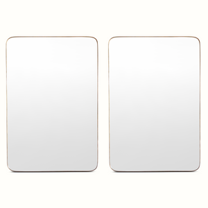 Two wall mirrors with rounded-rectangle shapes and brass-toned frames