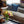 Gray upholstered sofa with blue patterned throw pillows and cushioned seating
