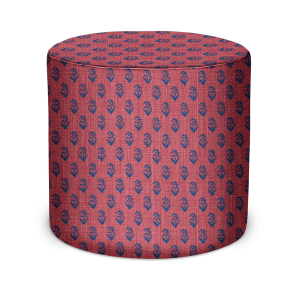 Indigo and raspberry patterned cylindrical indoor pouf with flat top