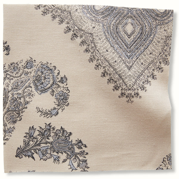 Charcoal-and-silver patterned pillow cover with ornate medallion and floral details