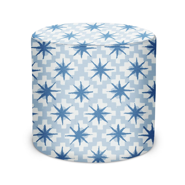 Blue starburst-pattern cylindrical indoor pouf with padded top