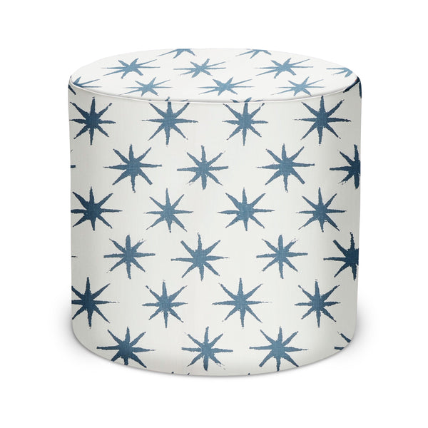 Indoor pouf with indigo star pattern on white fabric, round cushioned top