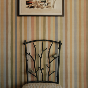 Faux bois metal side chair with curved branch back and patterned seat cushion