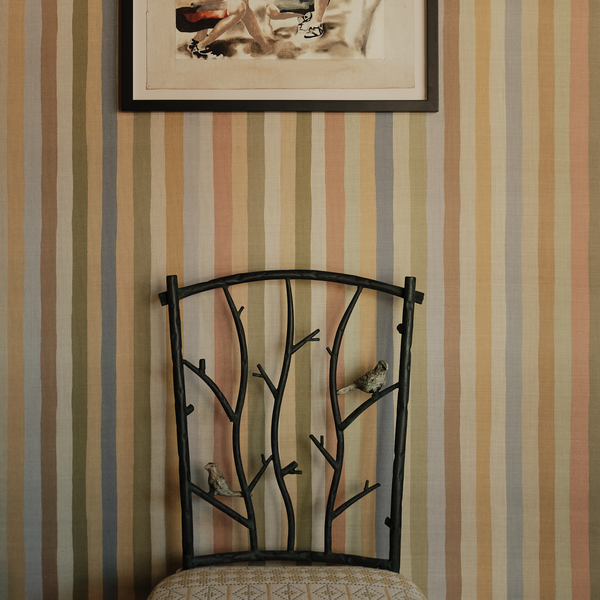 Faux bois metal side chair with curved branch back and patterned seat cushion