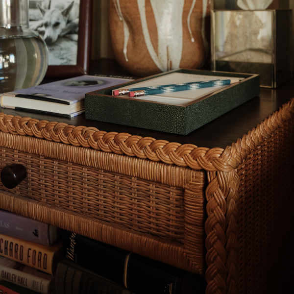 Small wicker bedside table with woven front and side drawer