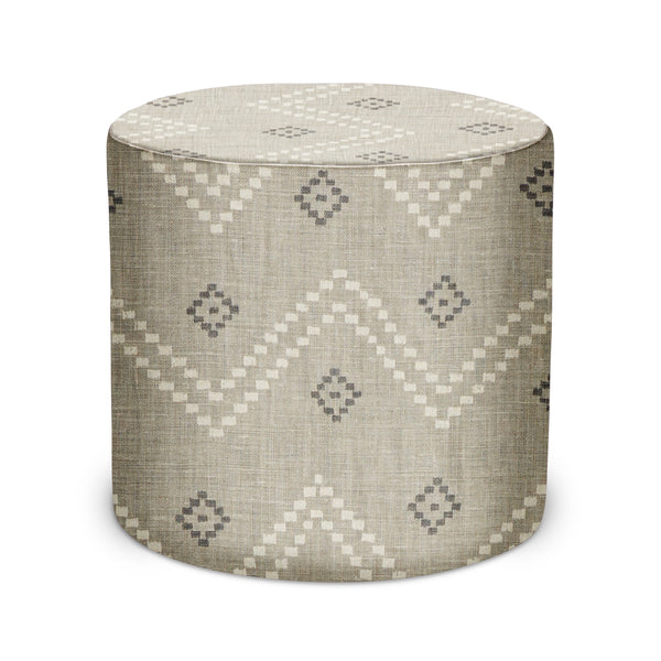 Round upholstered indoor pouf ottoman with geometric ash-and-natural pattern