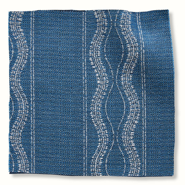 Lapis blue outdoor pillow cover with woven wave-and-stripe pattern