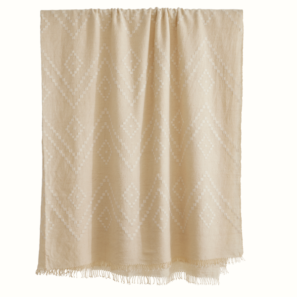 Zigzag Indian bedcover in white, draped top with diamond zigzag pattern and fringe