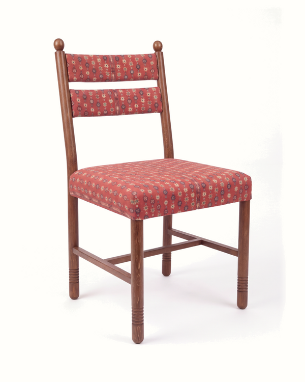 Upholstered dining chair, patterned red fabric seat and back, angled wooden frame