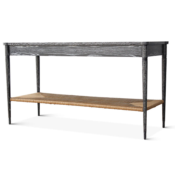 Black console table with long woven paper rush shelf and angled side rails.