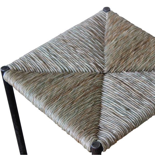 Woven rush stool seat with cross-hatched weave and dark metal legs