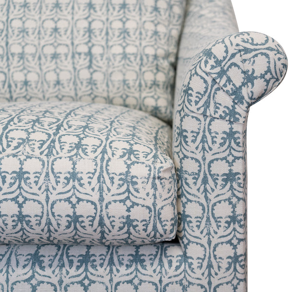 The Melrose Armchair, designed by Hollywood at Home founder Peter Dunham, is inviting and comfortable, featuring loose cushions, a turned arm, and tapered legs.