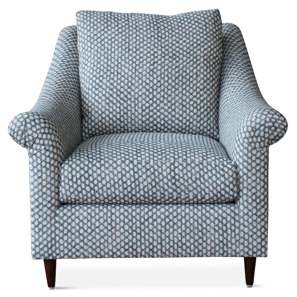 The Melrose Armchair, designed by Hollywood at Home founder Peter Dunham, is inviting and comfortable, featuring loose cushions, a turned arm, and tapered legs.